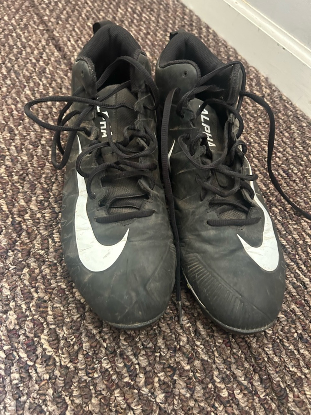 Nike Black Cleats with White Swoosh